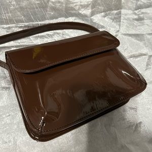 Cute brown purse with adjustable straps in excellent condition.